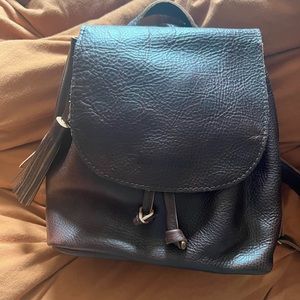 Portland leather goods bucket backpack cold brew